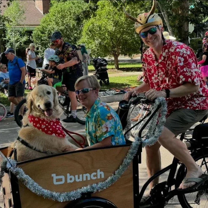 Golden retriever riding with an adult passenger in a parade in the k9 bunch bike #color_Honey Woodgrain