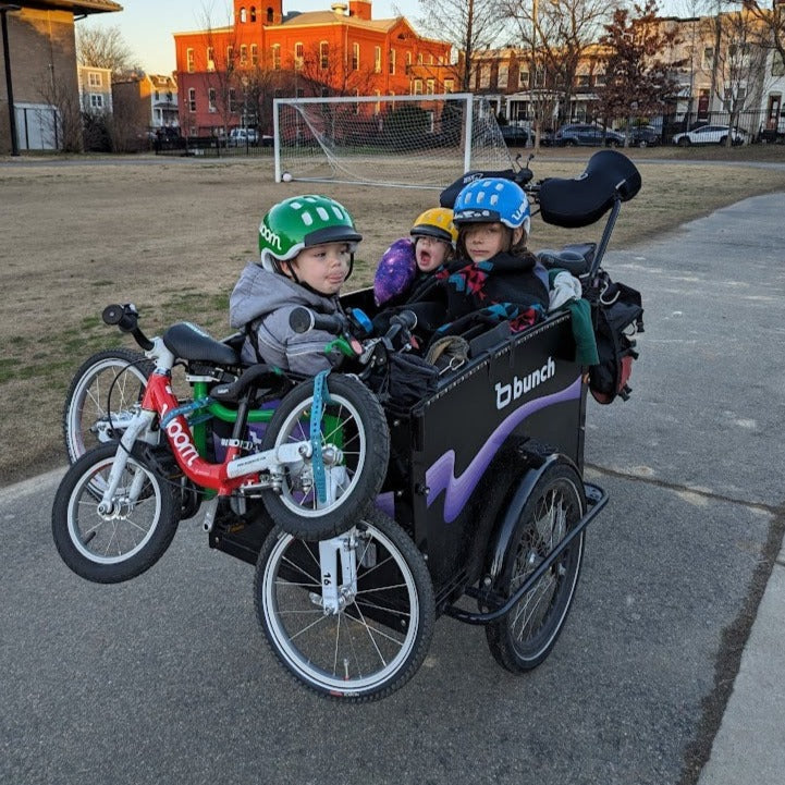 Bunch Bike with 2 woom bikes strapped to front panel