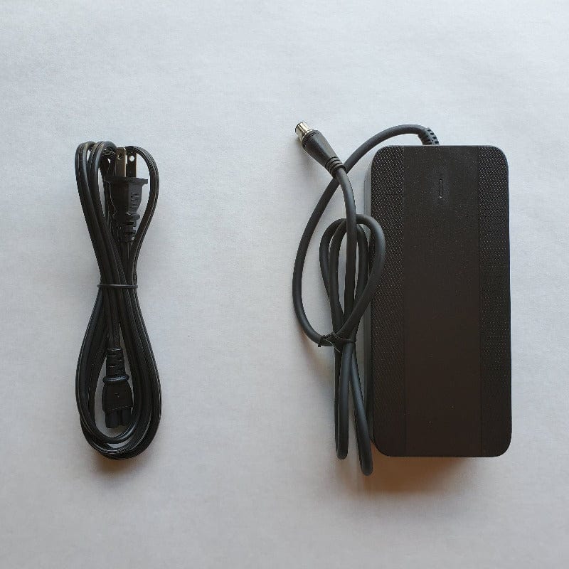Black charger and charge cord for Bunch Bikes Coupe electric cargo tricycle