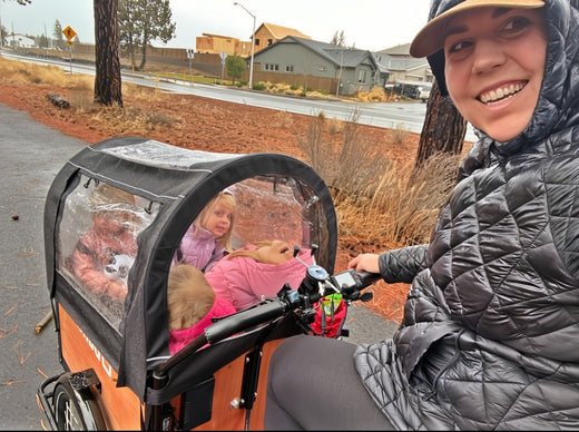 Mom in coat with kids in bunch bike original