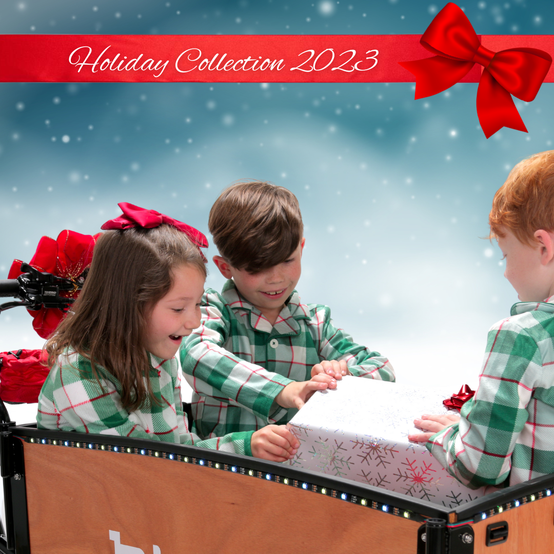 Three kids opening a gift in Bunch Bike - Holiday gifts